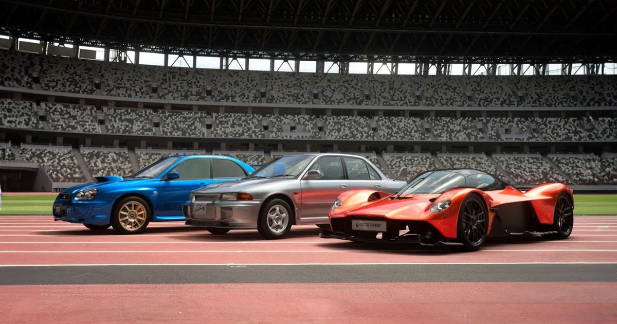 Gran Turismo 7 in-game image of a blue Subaru, silver Mitsubishi, and a red super car inside an arena.