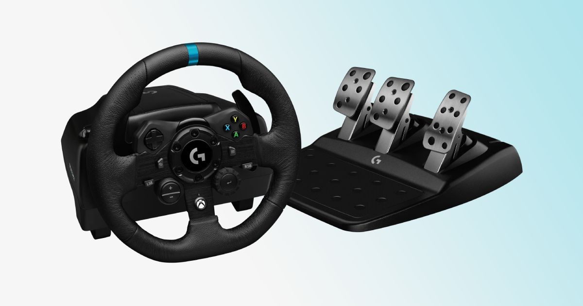 A black racing wheel with a blue central line at the top next to a three-pedal set and in front of a gradient white and light blue background.