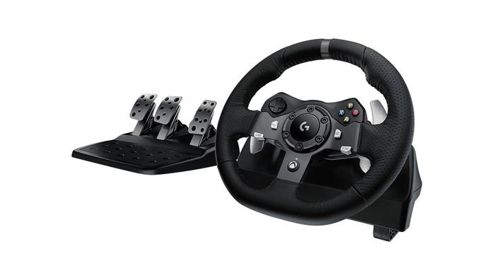 Best Cyber Monday deals - Logitech G290 product image of a black wheel with a set of pedals.
