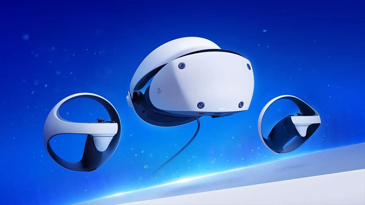 A white and black VR headset in front of a blue background and next to two white and black joystick controllers.