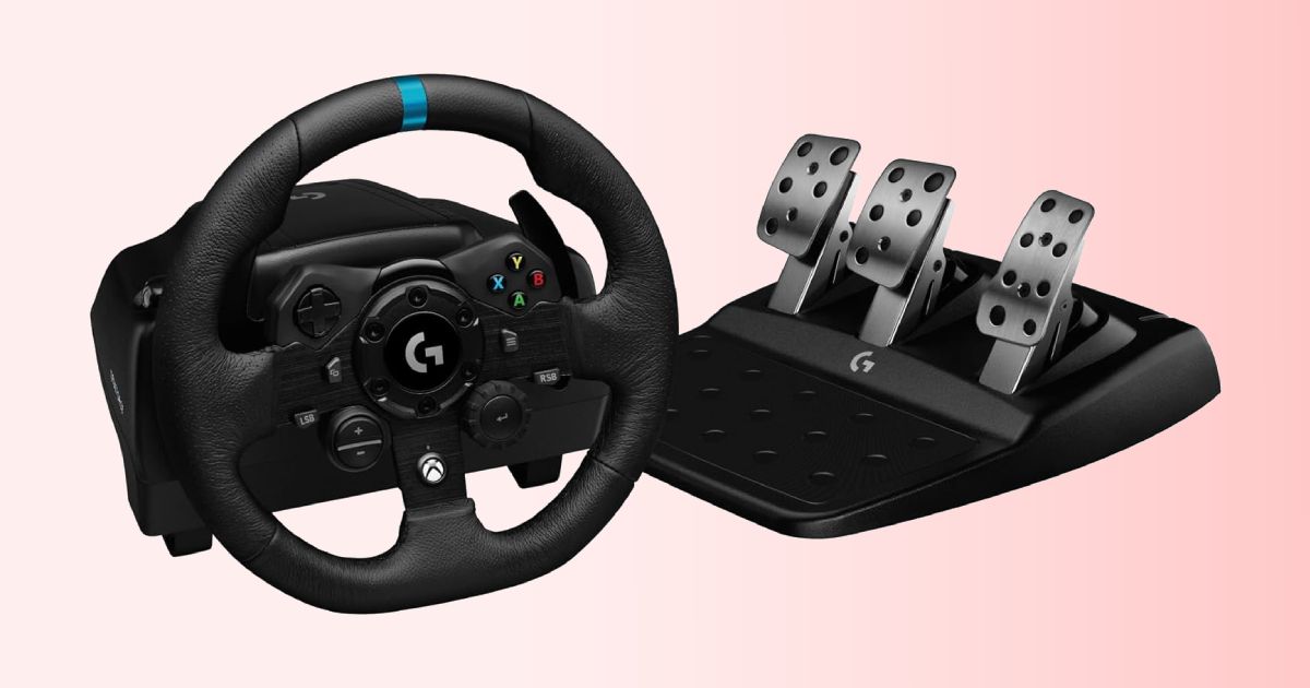A black racing wheel with a blue centre line at the top of the wheel, next to a set of metal pedals.