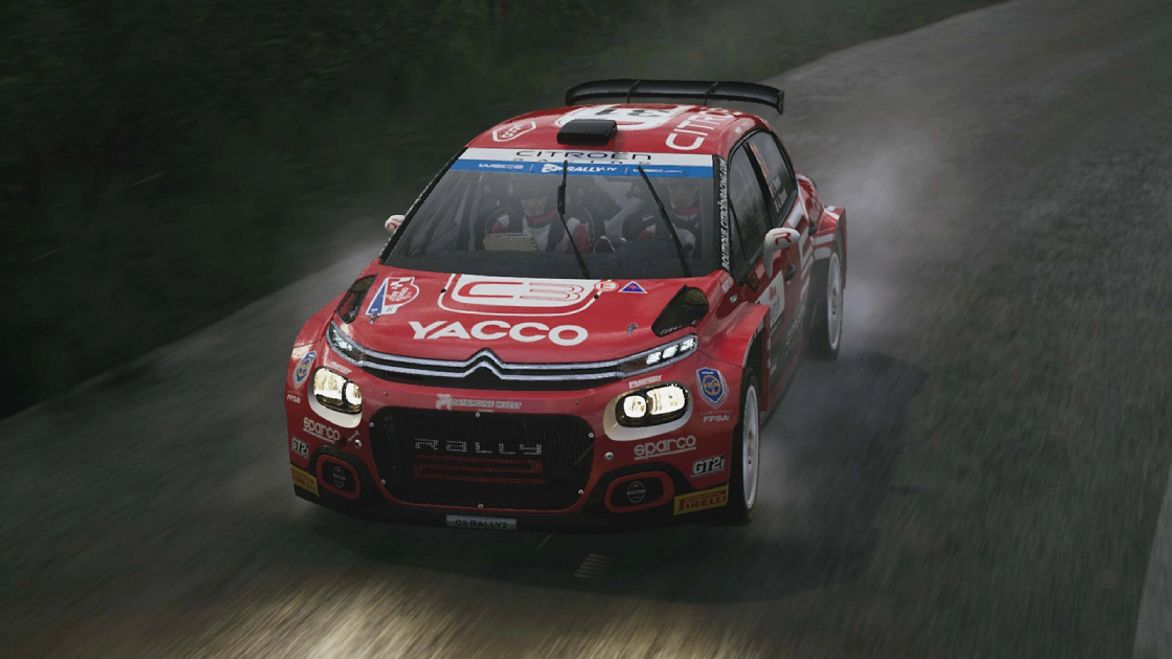 A red Citroën rally car with white and blue stickers on it racing in the rain.