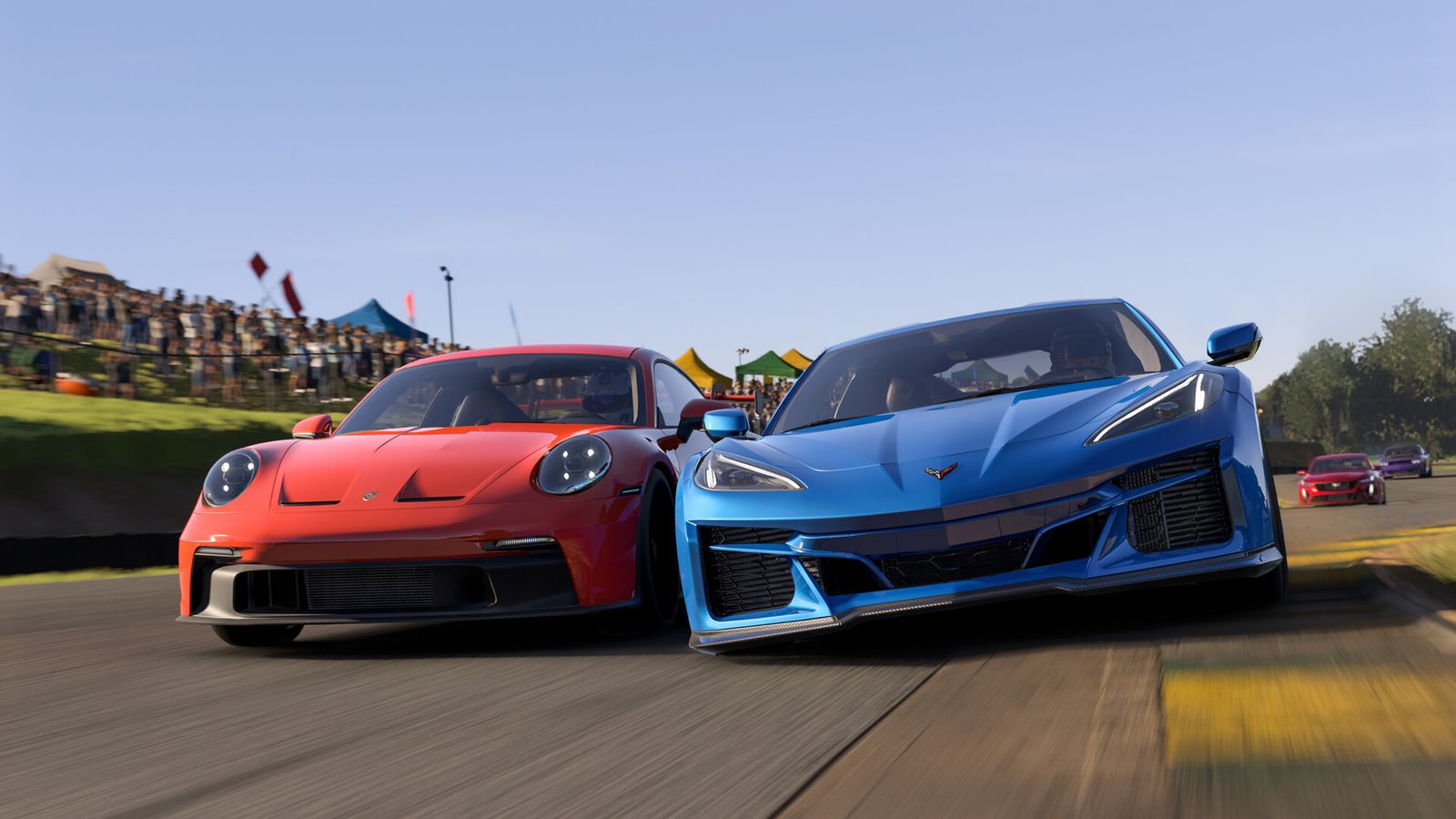 A red Porsche and blue Corvette racing side-by-side.