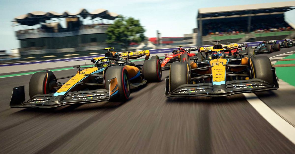 F1 Manager in-game image of the two orange and light blue McLaren F1 cars leading the pack on a track.