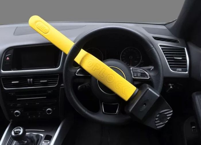 Best steering wheel lock Stoplock product image of a yellow and black bit of kit.