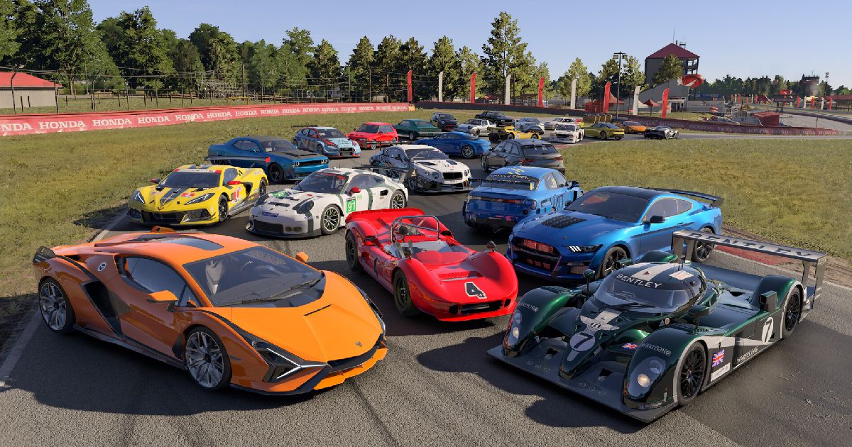 A collection of cars parked on a corner of a track in Forza Motorsport. At the front of the pile, an orange super car and a black super car featuring green and white trim.