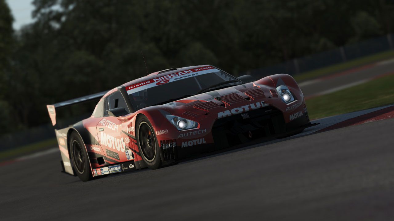 rFactor 2 in-game image of a red Nissan racing car with white sponsors all over.