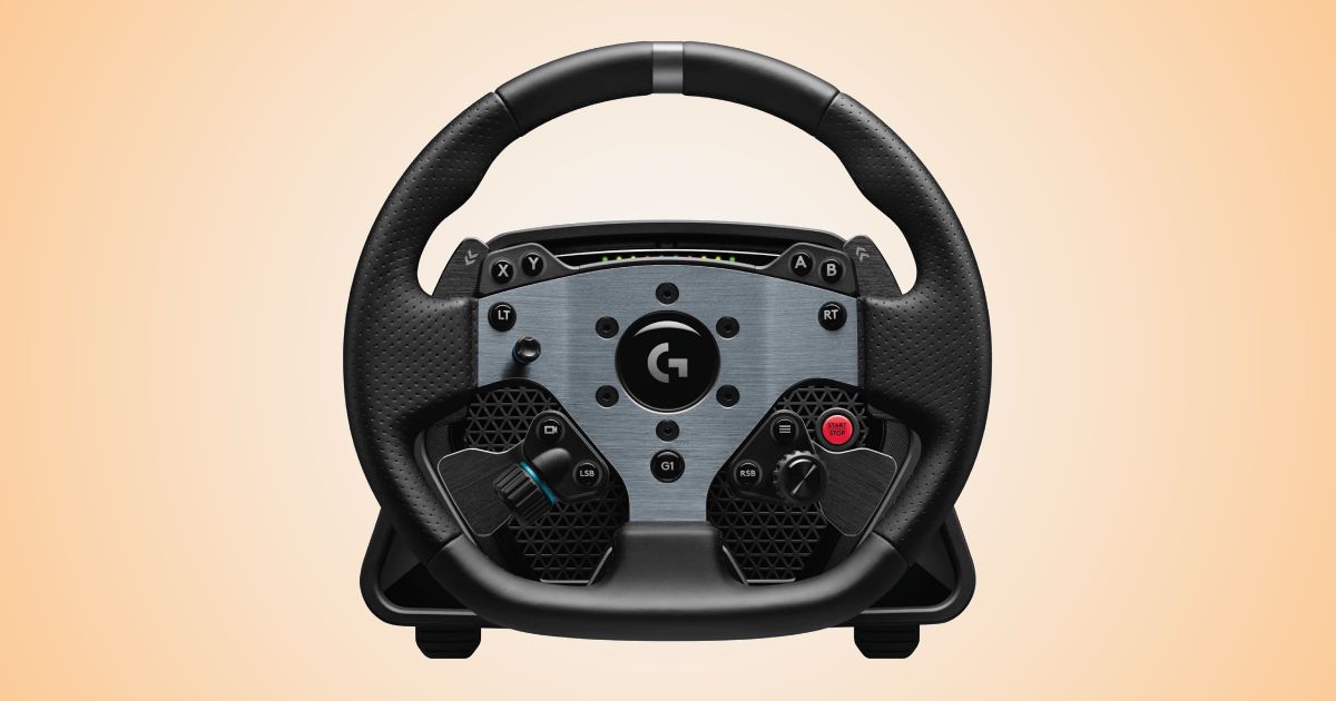 A black and dark grey metal racing wheel in front of an orange and white gradient background.