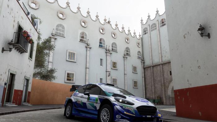 Guanajuato University with a Ford Focus rally car parked outside in Forza Horizon 5