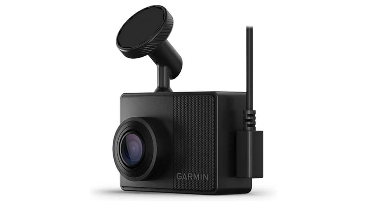 Garmin Dash Cam 67W product image of a small black camera with a wireless antenna and a sticky mounting point.