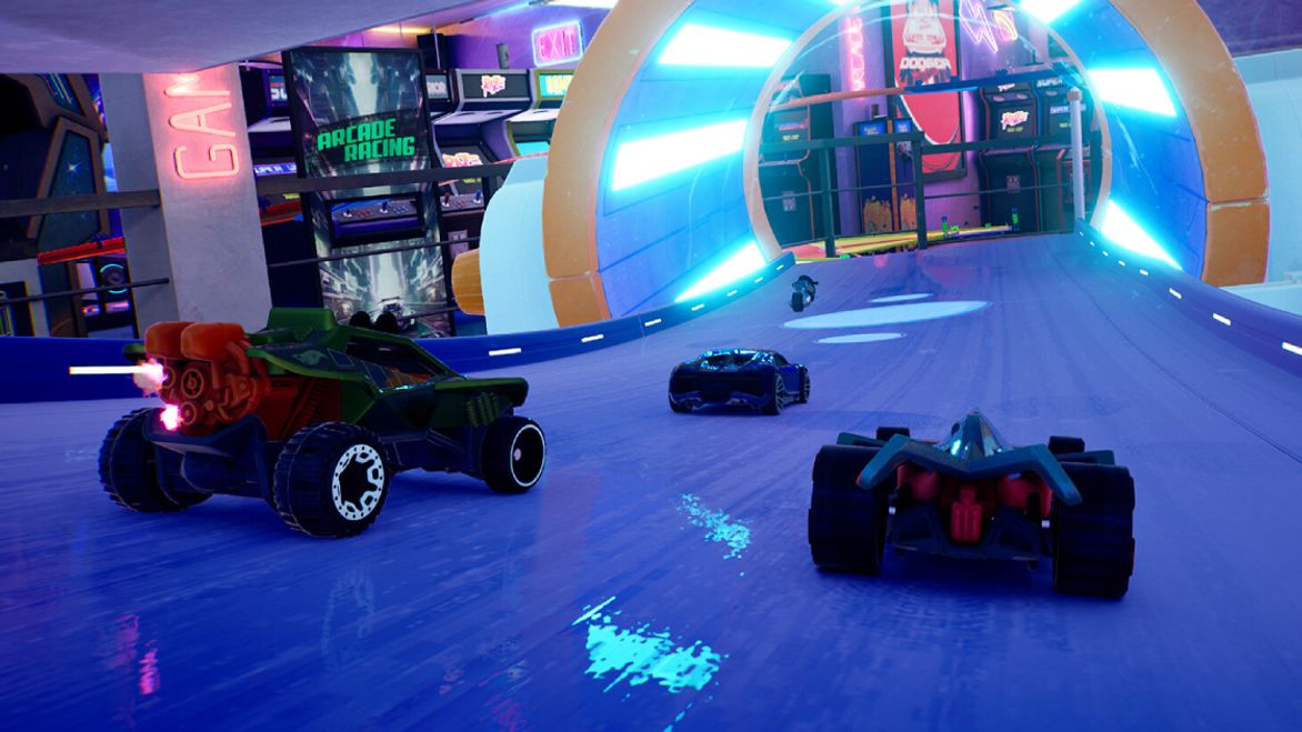Three Hot Wheels cars behind a bike, racing on a blue track going into an orange tunnel of blue light.