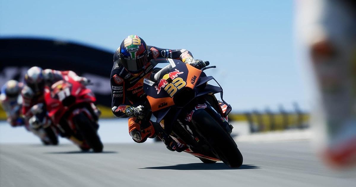Someone riding a navy and orange Red Bull-branded bike in MotoGP 24.