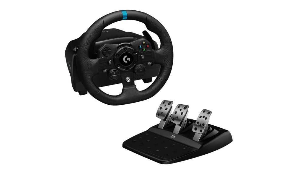 Logitech G923 product image of a black racing wheel with a blue centre line at the top next to a set of black metal pedals.