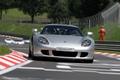 Gran Turismo 7 in-game image of a silver Porsche driving on a track.