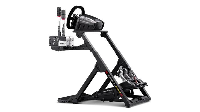 Best racing wheel stand for F1 23 - Next Level Racing Wheel Stand 2.0 product image of a black stand with a wheel, pedals, and a shifter attached.